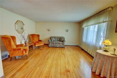 Living Rm w/gleaming HW flrs + bright front pictur