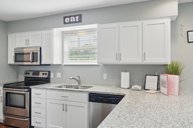 Sunny Kitchen With Granite Countertops