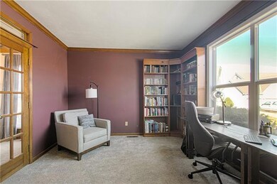 den/library area w/french doors to entry and livin