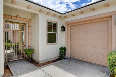 Gated entrance to courtyard and single car garage
