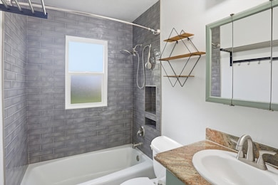 Full bathroom featuring vanity and bathing tub / shower combination
