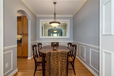 Dining room has wonderful details with crown moldi