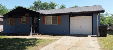 Single story home with concrete driveway, roof wit