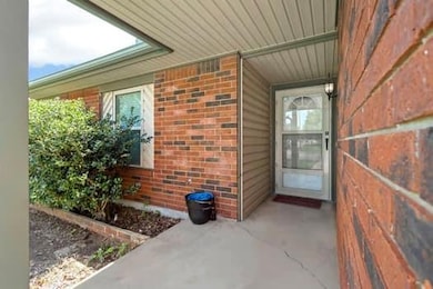 Property entrance with brick siding
