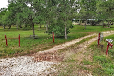 View of property's community featuring a lawn