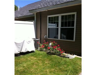 Exterior Front. Rose flowerbed