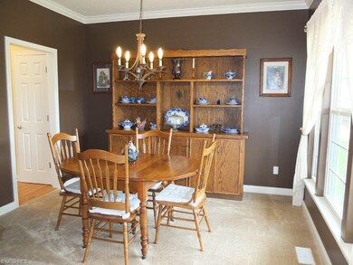 Formal dining room with crown molding.