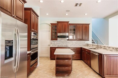 Kitchen with stainless steel appliances and quartz