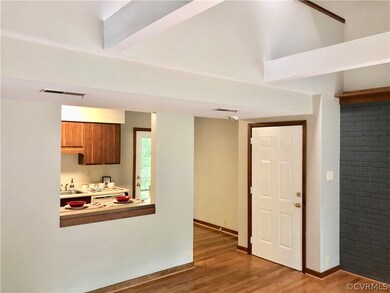 Enter into the great room with hardwood floors and