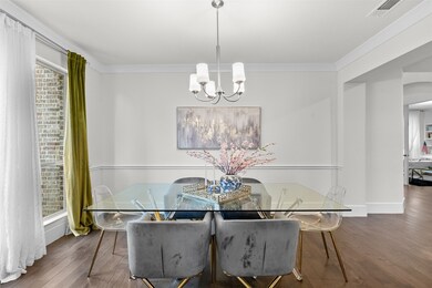 The formal dining room offers timeless elegance wi