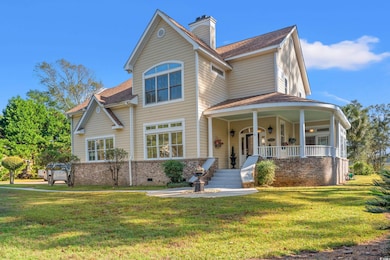 View of front facade featuring a front lawn and co