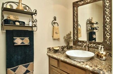 Powder Room with vessel sink and granite counter t