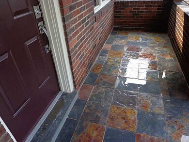 Exterior Front. Front porch with slate tile