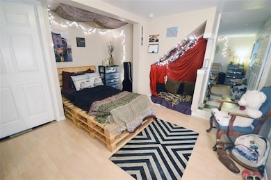 Bedroom with wood finished floors