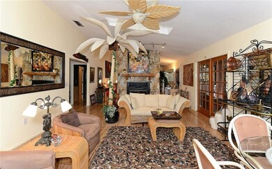 Open floor plan with floor to ceiling stone woodbu
