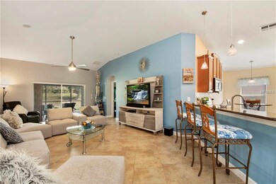 Great room with vaulted ceiling, tile floors, ceil