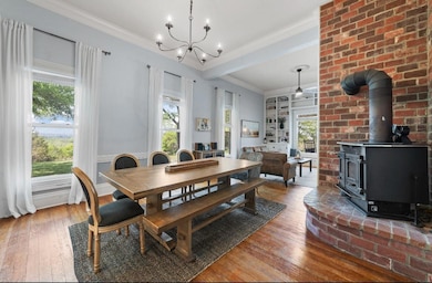Dining space with wood-type flooring, a notable c