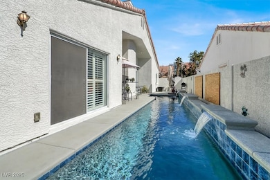 View of swimming pool featuring fence