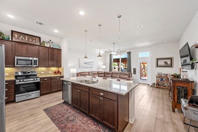 Kitchen with a granite island, stainless steel app