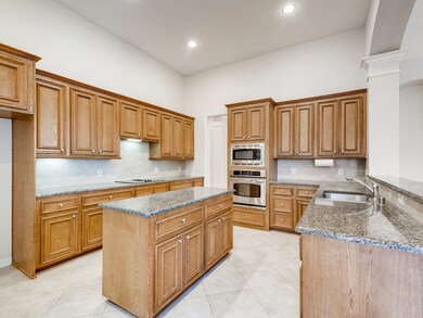 Continue down the large Foyer and discover the Gourmet Kitchen complete with large Island & Stainless Steel Appliances.