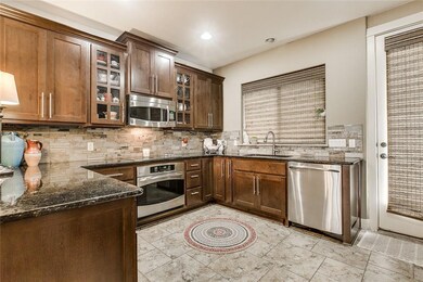 Kitchen featuring stainless steel appliances, dar