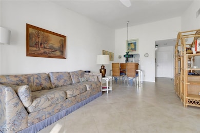 Living room with light tile patterned floors