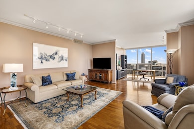 Gracious living room with hardwood floors, crown m