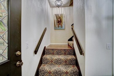 Foyer and stairs to bedrooms 3 and 4.
