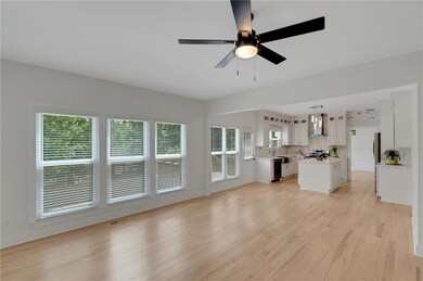 Unfurnished living room with light wood-type floor