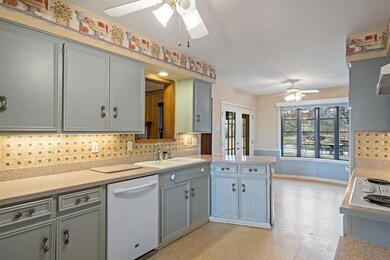 This kitchen already peers into the family room an