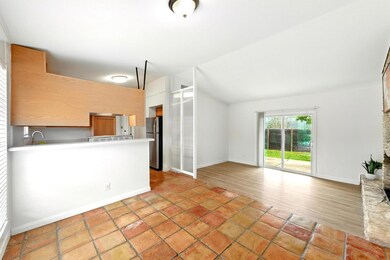 Kitchen featuring freestanding refrigerator, loft
