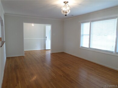 Large living room with hardwood floors, new paint,
