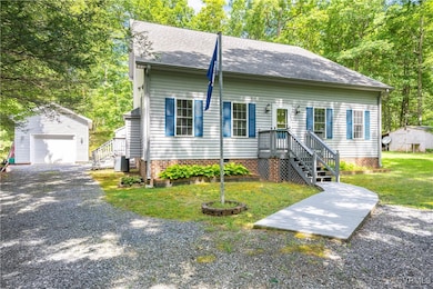 View of front of house with an outdoor structure,