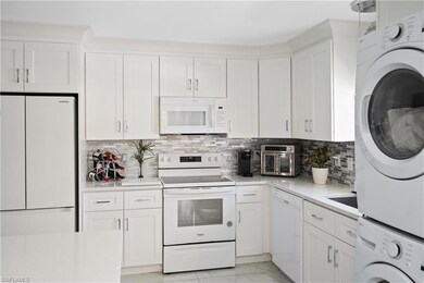 Kitchen featuring white cabinets, light countertop