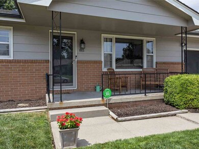 COVERED FRONT PORCH WELCOMES GUESTS