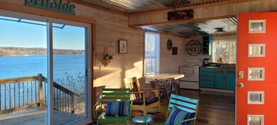 Living room portion with view to eat-in