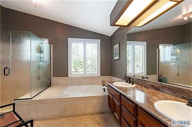 The master bath features a raindrop shower enclosu