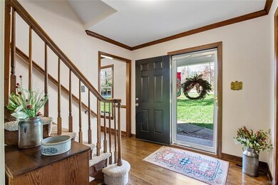 Gleaming hardwood floors greet you in the sunny foyer.