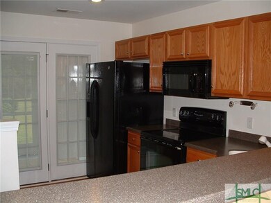 view of kitchen from dining area.  Corian counters
