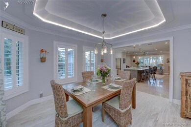 Dining room with lighting in trey ceiling.