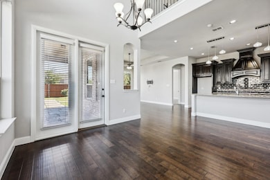 Entrance foyer featuring dark hardwood / wood-styl