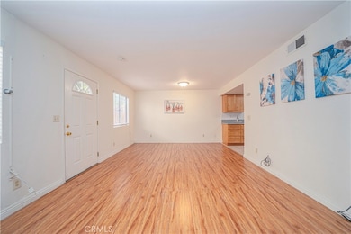 Front door Entrance with Open Floor plan connected to Living Room, Dine Room and Kitchen