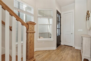 View of front door and coat closet