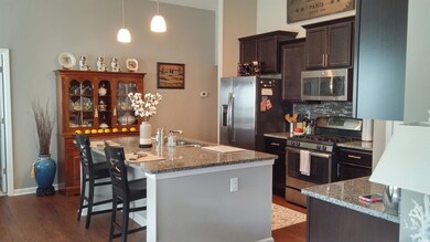 Kitchen with a kitchen bar, stainless steel applia