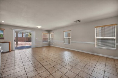 Unfurnished room with light tile patterned floorin
