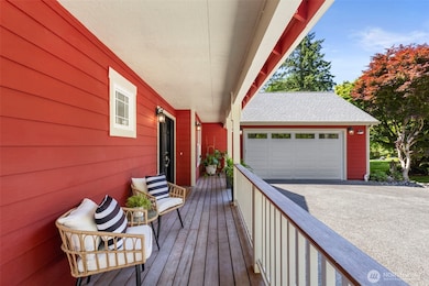 Enjoy morning coffee or evening wine on the porch perfect for quiet covered moments outdoors.