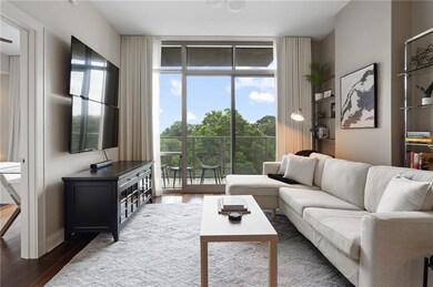 Living area with wood finished floors and plenty of natural light