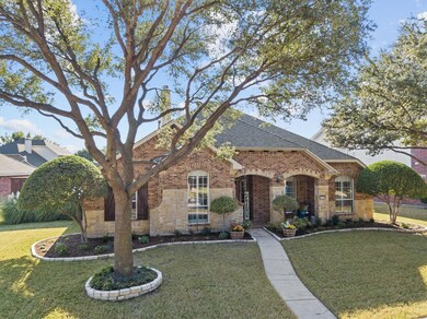 Professional landscaping and covered front patio