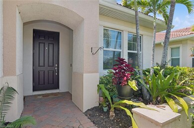 Entrance to property featuring stucco siding