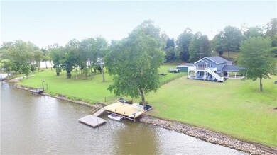 Perfectly Level Backyard Leading to The Pier Area with Floating Dock